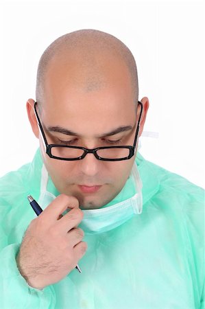 simsearch:6109-06005901,k - Details an surgeon thinking with documents and pencil Fotografie stock - Microstock e Abbonamento, Codice: 400-04018300