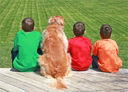 simsearch:400-04449607,k - Three Boys and a Dog Sitting on a Deck Photographie de stock - Aubaine LD & Abonnement, Code: 400-04018541