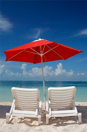 simsearch:400-06947087,k - Sun loungers and parasol on an empty tropical beach Stock Photo - Budget Royalty-Free & Subscription, Code: 400-04018665