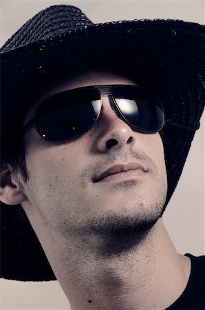 Portrait of young male wearing dark sunglasses Stock Photo - Budget Royalty-Free & Subscription, Code: 400-04019780