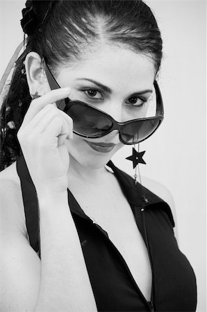 peeping fashion - Portrait of Hispanic female wearing dark sunglasses Stock Photo - Budget Royalty-Free & Subscription, Code: 400-04019794