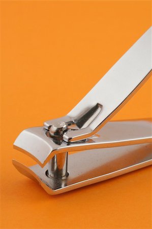 simsearch:400-04590632,k - nail clippers on orange Stock Photo - Budget Royalty-Free & Subscription, Code: 400-04019844