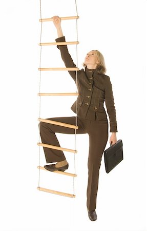 simsearch:400-08288188,k - An isolated photo of a businesswoman climbing a rope-ladder Photographie de stock - Aubaine LD & Abonnement, Code: 400-04010071