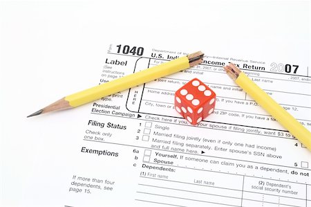 simsearch:400-05339747,k - red die and broken pencil over 1040 tax form Stock Photo - Budget Royalty-Free & Subscription, Code: 400-04010127