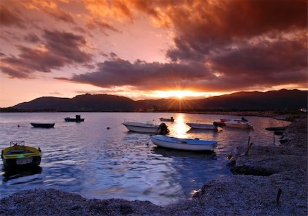 simsearch:400-03996788,k - Beautiful sunset over harbor with dramatic sky on Sardinia Photographie de stock - Aubaine LD & Abonnement, Code: 400-04010332