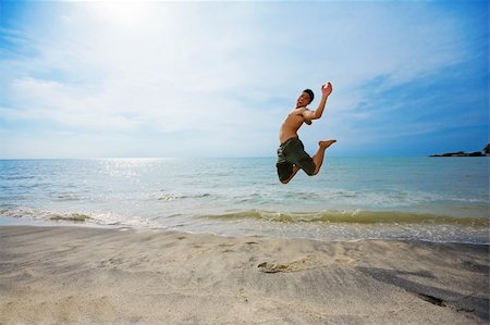 eyedear (artist) - excited man jump up high happily by the beach Stock Photo - Budget Royalty-Free & Subscription, Code: 400-04010518