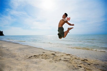 eyedear (artist) - happy man jumping up high by the beach in a beautiful day Stock Photo - Budget Royalty-Free & Subscription, Code: 400-04010519