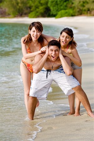 eyedear (artist) - group of friends teasing and pulling ears of the guy by the beach Stock Photo - Budget Royalty-Free & Subscription, Code: 400-04010522