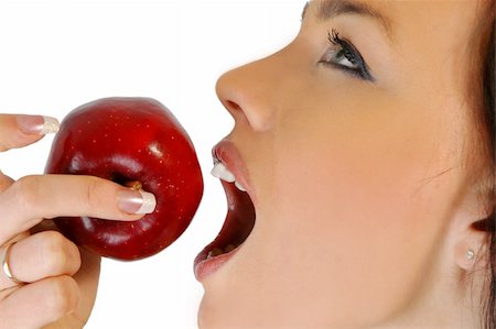 decaying fruit photography - attractive woman eating an apple isolated on white Stock Photo - Budget Royalty-Free & Subscription, Code: 400-04010749
