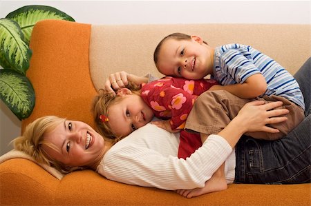 Happy woman and kids having fun indoors Stock Photo - Budget Royalty-Free & Subscription, Code: 400-04011566
