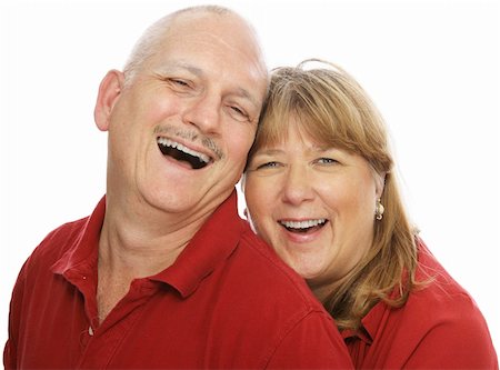 simsearch:400-05234340,k - Happy middle aged couple laughing together.  Isolated on white. Stock Photo - Budget Royalty-Free & Subscription, Code: 400-04011584