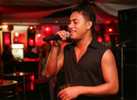 simsearch:400-04608129,k - Singer at an alive concert in a night club "La vida loka". Bali. Indonesia Foto de stock - Super Valor sin royalties y Suscripción, Código: 400-04011865
