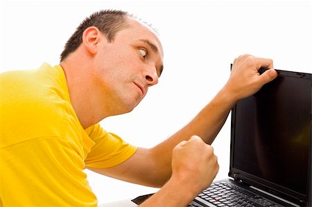 simsearch:400-04973534,k - An angry man attacking the laptop because it doesn't works. Stock Photo - Budget Royalty-Free & Subscription, Code: 400-04011927