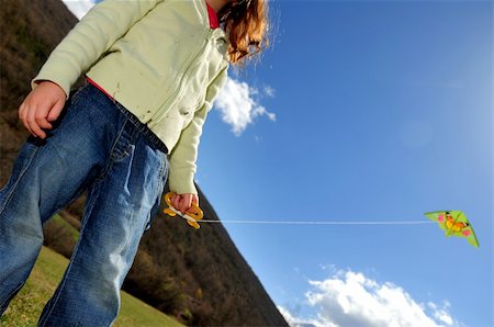 simsearch:400-04958295,k - girl holding a green kite against blue sky Stockbilder - Microstock & Abonnement, Bildnummer: 400-04012314