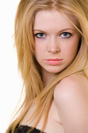 simsearch:400-04498992,k - Attractive close up of face of a woman with long blond hair and blue eyes with serious expression over white Photographie de stock - Aubaine LD & Abonnement, Code: 400-04012542