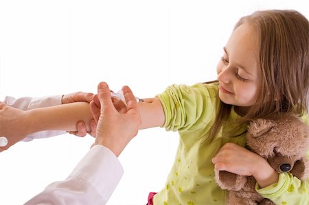 Little girl getting an injection-studio shot, isolated on white Stock Photo - Budget Royalty-Free & Subscription, Code: 400-04012620