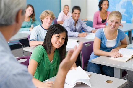 Group Of High School Students Listening To Teacher In Classroom Stock Photo - Budget Royalty-Free & Subscription, Code: 400-04012854