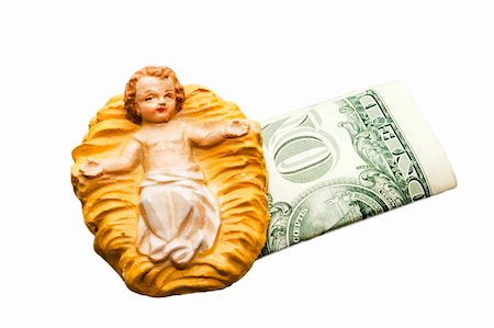 simsearch:400-04518512,k - Commercialism vs Christmas, the Christ child and one dollar bills. Foto de stock - Royalty-Free Super Valor e Assinatura, Número: 400-04012892
