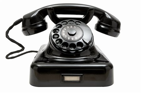 simsearch:400-03986450,k - Old-fashioned phone isolated on a white background. Photographie de stock - Aubaine LD & Abonnement, Code: 400-04013024