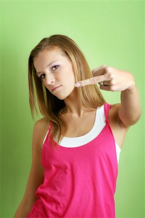 simsearch:400-04226490,k - portrait of a young unhappy woman is showing the finger Foto de stock - Royalty-Free Super Valor e Assinatura, Número: 400-04013364