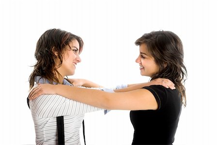 simsearch:400-04624187,k - Two young beautiful sisters having fun isolated on white - This models are true twins Fotografie stock - Microstock e Abbonamento, Codice: 400-04013394