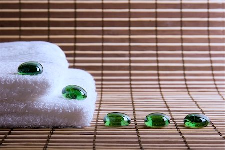 slicky (artist) - two white towels and five glass green stones Foto de stock - Royalty-Free Super Valor e Assinatura, Número: 400-04013503