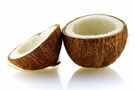 two pieces of ripe coconut over white background Foto de stock - Super Valor sin royalties y Suscripción, Código: 400-04013510