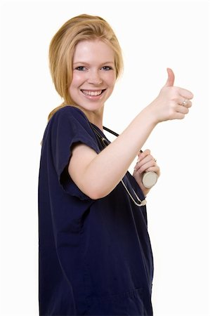 simsearch:400-05172792,k - Young pretty woman healthcare worker wearing blue scrubs and a stethoscope holding thumb up on white Foto de stock - Royalty-Free Super Valor e Assinatura, Número: 400-04013526