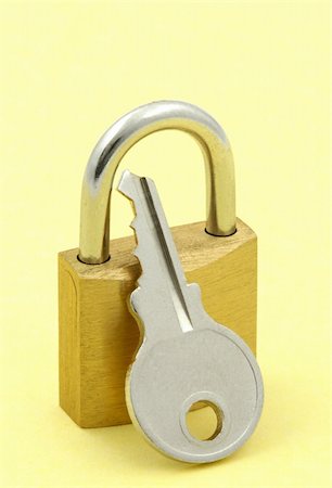 simsearch:400-05320318,k - close-up of padlock and key against yellow background Stock Photo - Budget Royalty-Free & Subscription, Code: 400-04024056