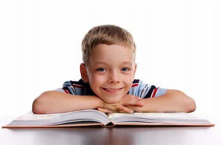 Smiling schoolboy with book Stock Photo - Budget Royalty-Free & Subscription, Code: 400-04024179