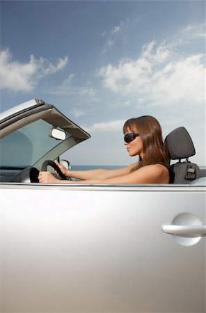 Woman and her cabriolet car at beach Stock Photo - Budget Royalty-Free & Subscription, Code: 400-04024633
