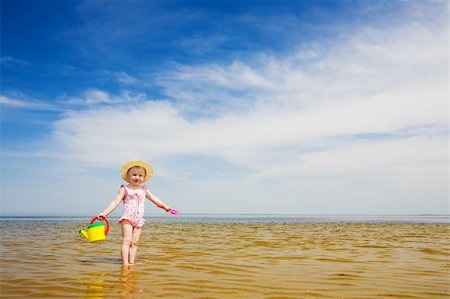 simsearch:400-04596901,k - small girl with watering-pot on the seashore Stock Photo - Budget Royalty-Free & Subscription, Code: 400-04024790