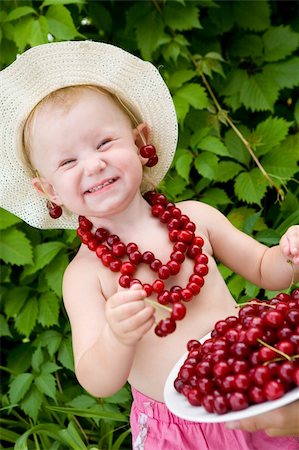 small girl with red cherry beads and earings Stock Photo - Budget Royalty-Free & Subscription, Code: 400-04024791