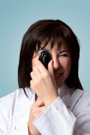 simsearch:400-07630065,k - A female optician turning the wheel dial of an opthalmoscope. closeup. Foto de stock - Super Valor sin royalties y Suscripción, Código: 400-04024807