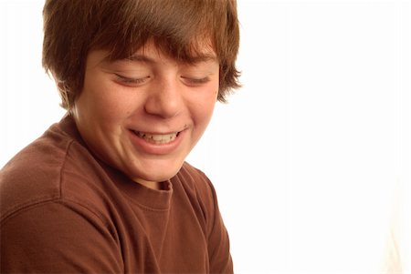 cute young teen boy with a bashful grin Stock Photo - Budget Royalty-Free & Subscription, Code: 400-04024817