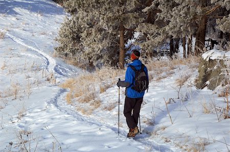 pictures of man snowshoeing - Man snowshoer climbing hill Stock Photo - Budget Royalty-Free & Subscription, Code: 400-04024996