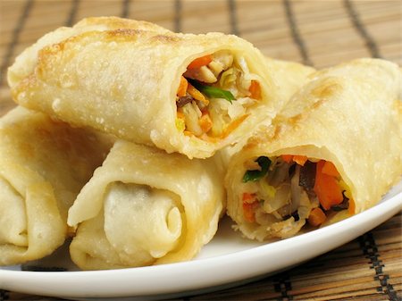 A delicious serving of egg rolls filled with chicken, napa cabbage, carrots, mung bean sprouts, wood ear fungus, and green onions. Stock Photo - Budget Royalty-Free & Subscription, Code: 400-04025069