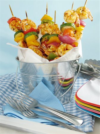 shrimp kebab - Shrimp kebabs with colorful bell peppers, red onions, and tomatoes, displayed in a metal bucket. Stock Photo - Budget Royalty-Free & Subscription, Code: 400-04025070