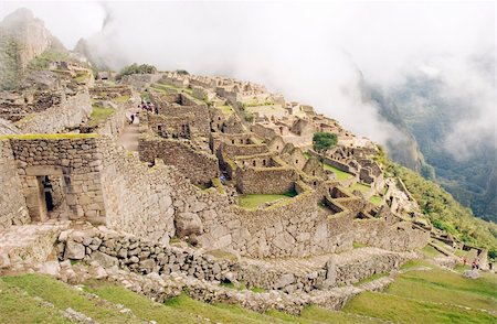 stone structures of machu picchu - The Lost Incan City of Machu Picchu under heavy fog near Cusco, Peru. Stock Photo - Budget Royalty-Free & Subscription, Code: 400-04025607