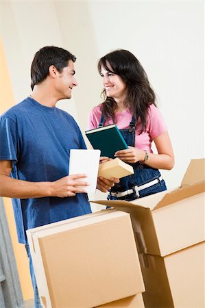 simsearch:614-03648212,k - Young happy couple moving boxes at home Stock Photo - Budget Royalty-Free & Subscription, Code: 400-04026115