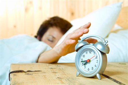 simsearch:6109-06194154,k - Close up view of  table clock and woman sleeping on back Foto de stock - Super Valor sin royalties y Suscripción, Código: 400-04026250