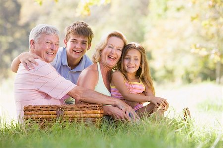 Grandparents having a picnic with grandchildren Stock Photo - Budget Royalty-Free & Subscription, Code: 400-04026622