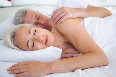 romantic pictures of lovers sleeping - Couple lying in bed together sleeping Stock Photo - Budget Royalty-Free & Subscription, Code: 400-04026663