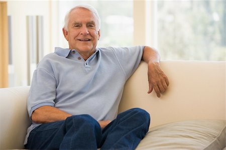 simsearch:400-04026722,k - Man in living room smiling Stock Photo - Budget Royalty-Free & Subscription, Code: 400-04026703