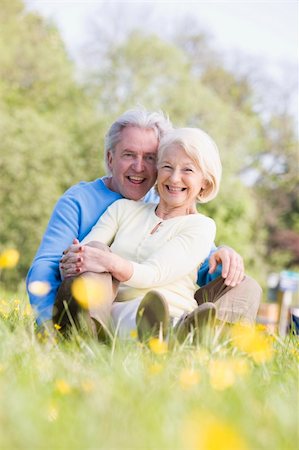 Couple relaxing outdoors smiling Stock Photo - Budget Royalty-Free & Subscription, Code: 400-04026766