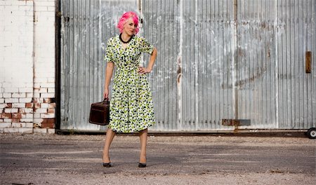 rejection of sweet - Woman with pink hair in an alley with small suitcase Stock Photo - Budget Royalty-Free & Subscription, Code: 400-04027235