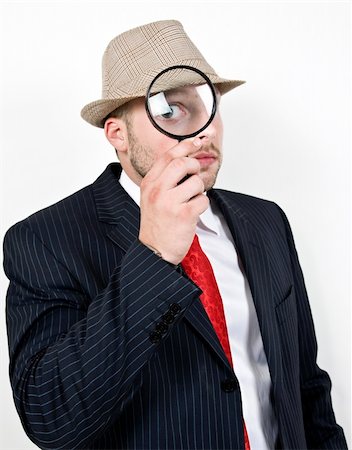 simsearch:400-05200843,k - man with magnifying glass on isolated background Foto de stock - Super Valor sin royalties y Suscripción, Código: 400-04027293