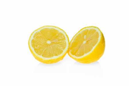 simsearch:400-05057164,k - Two lemon halves isolated on the white background Fotografie stock - Microstock e Abbonamento, Codice: 400-04027319