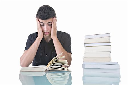 person reading a book confused - Portrait of a stressed young student with a pile of books to read. Stock Photo - Budget Royalty-Free & Subscription, Code: 400-04027504