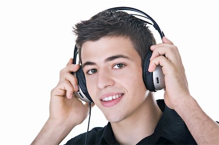 Young man, enjoying music with headphones. Isolated on white. Stock Photo - Budget Royalty-Free & Subscription, Code: 400-04027503